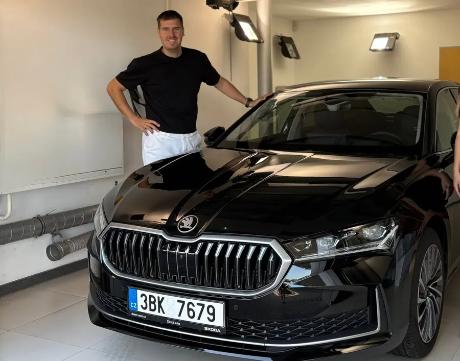 Matt beside his car